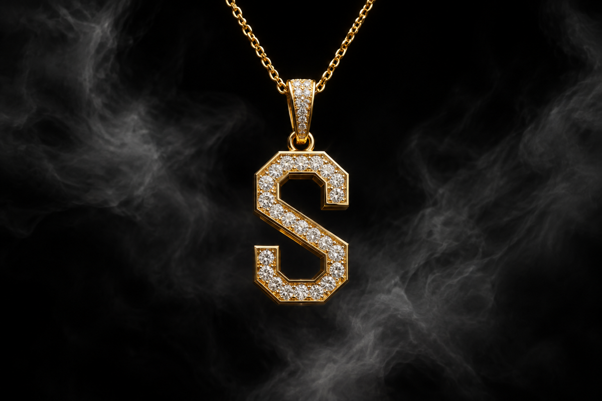 The Saintarini Diamond S Pendant — the house letterform set with brilliant-cut stones on a dark backdrop (placeholder image, to be replaced with the production photograph)