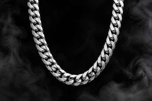 The Saintarini Cuban Chain in white gold — tightly interlocking links on a dark backdrop (placeholder image, to be replaced with the production photograph)
